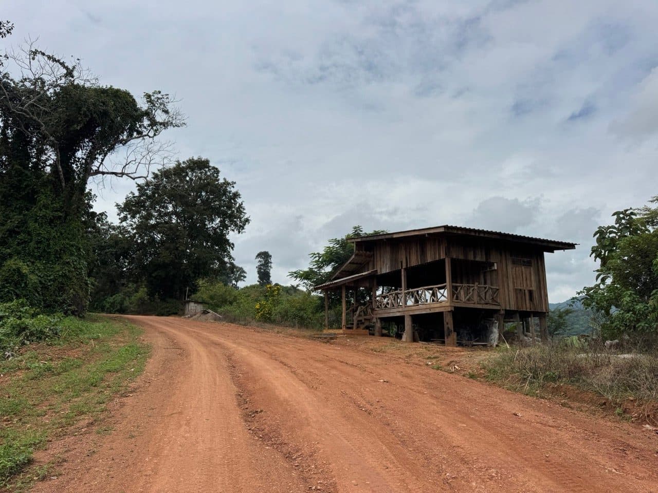 Wooden stilt house on the orange road