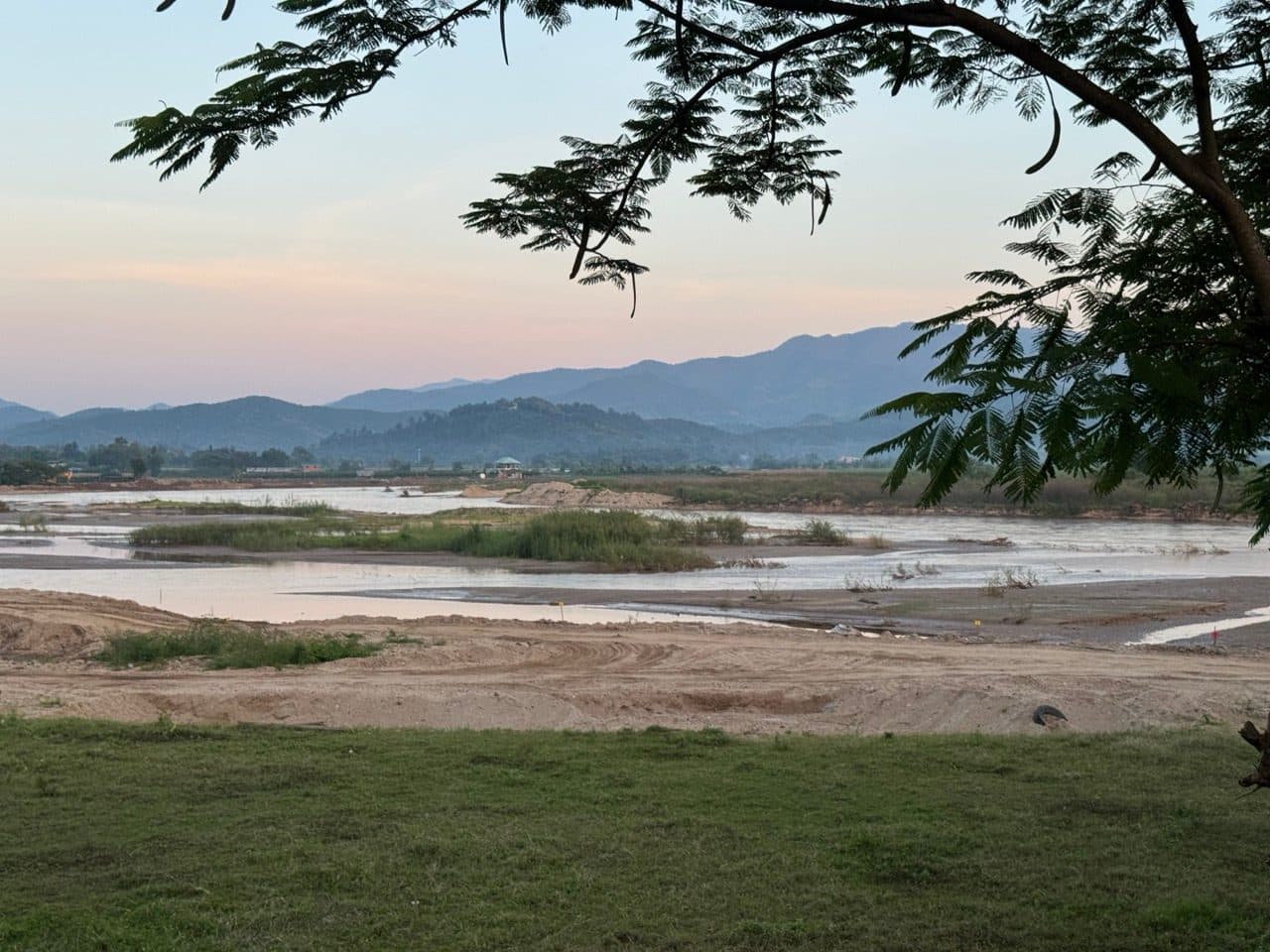 The Mae Kok at dusk, braided and wide.