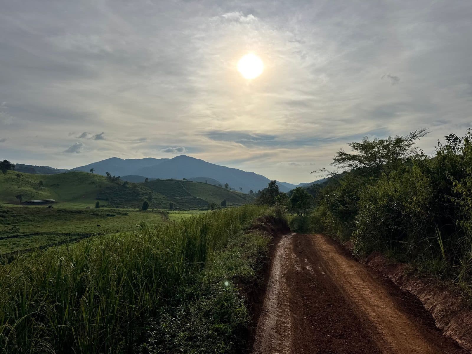 The sun already low and flat over the hills, with a long way still to go.
