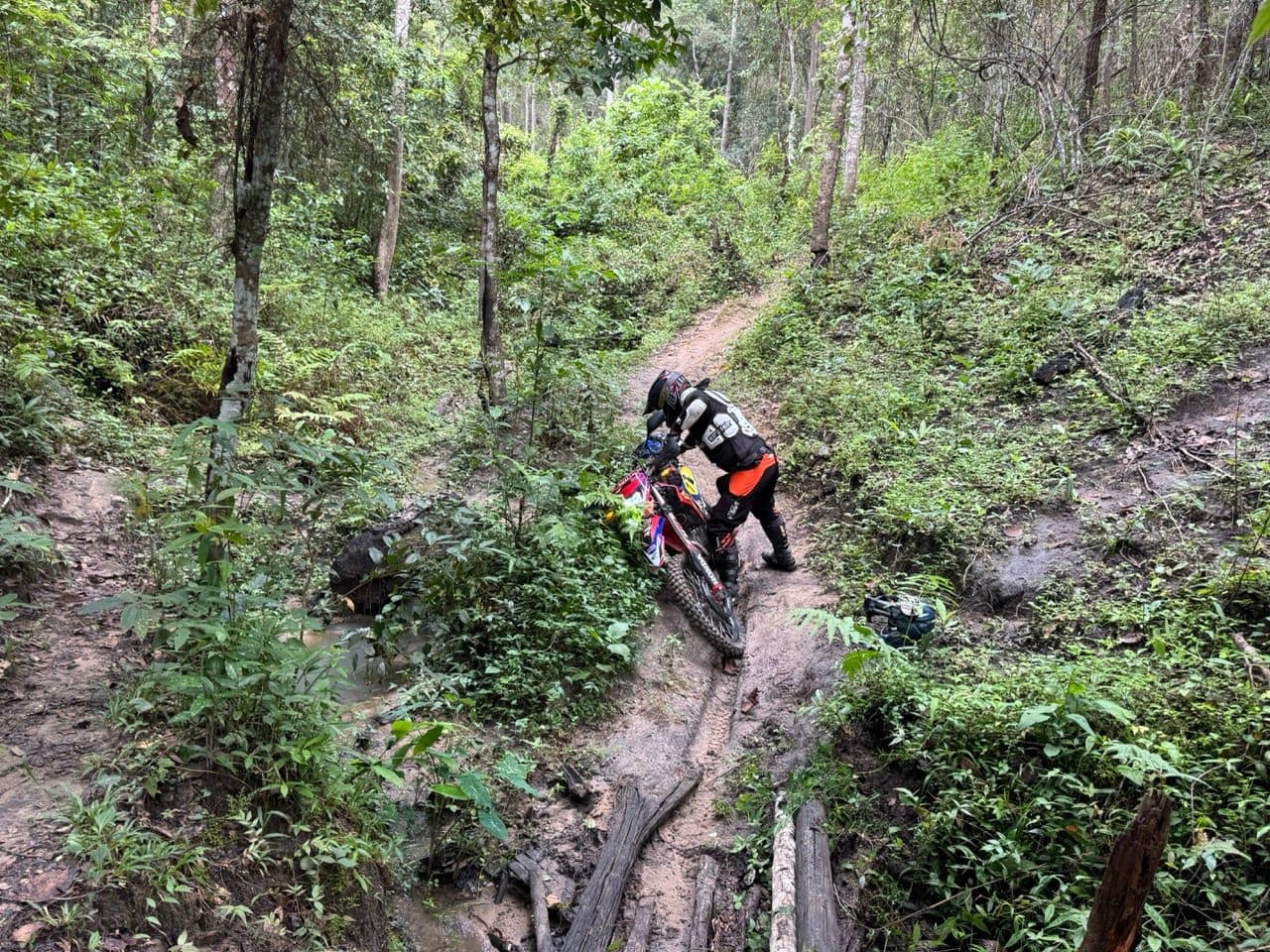 Off the bike and walking it up the wet rut above the culvert